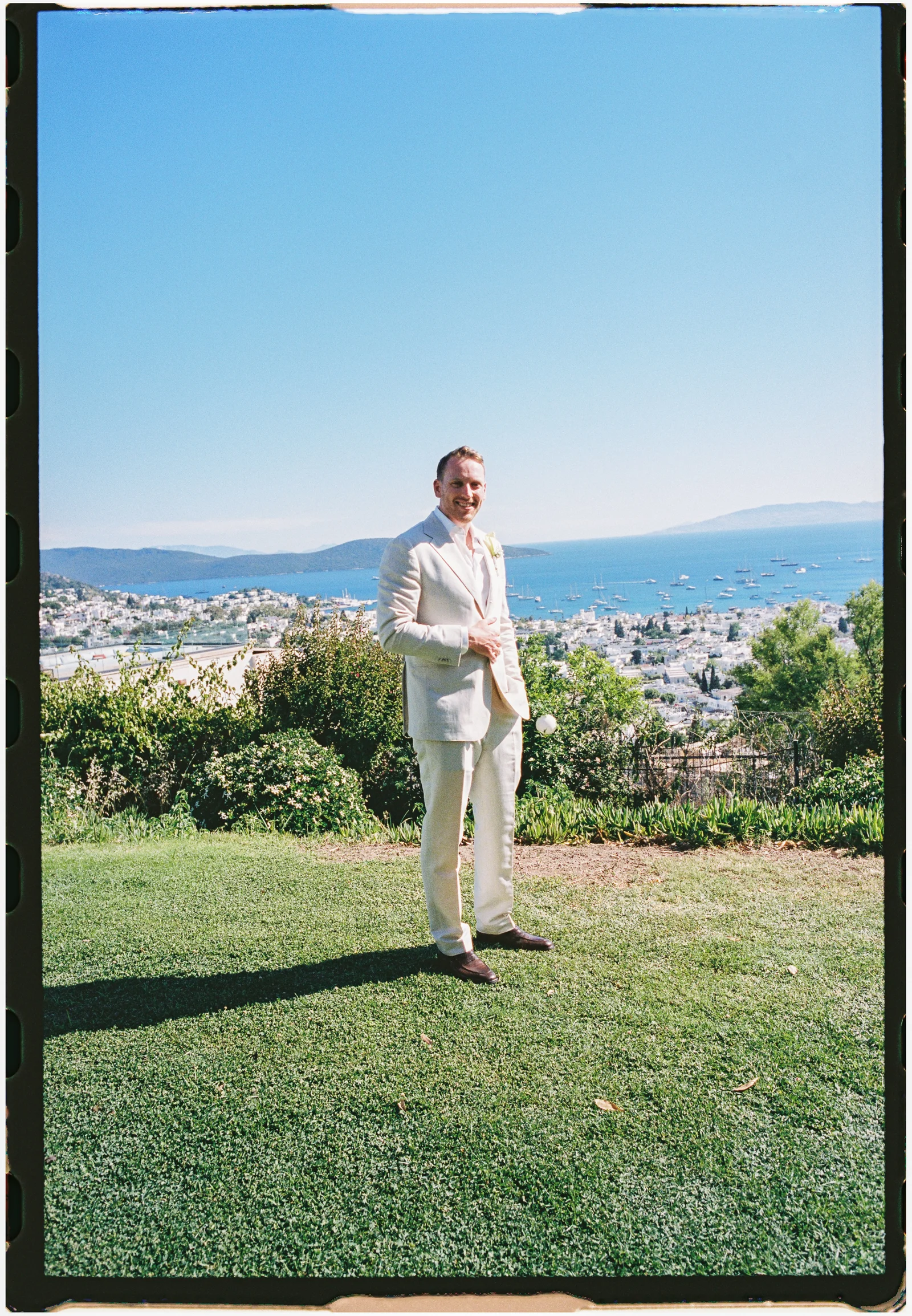 Groom on the lawn shot on film, The Marmara Bodrum Bodrum wedding