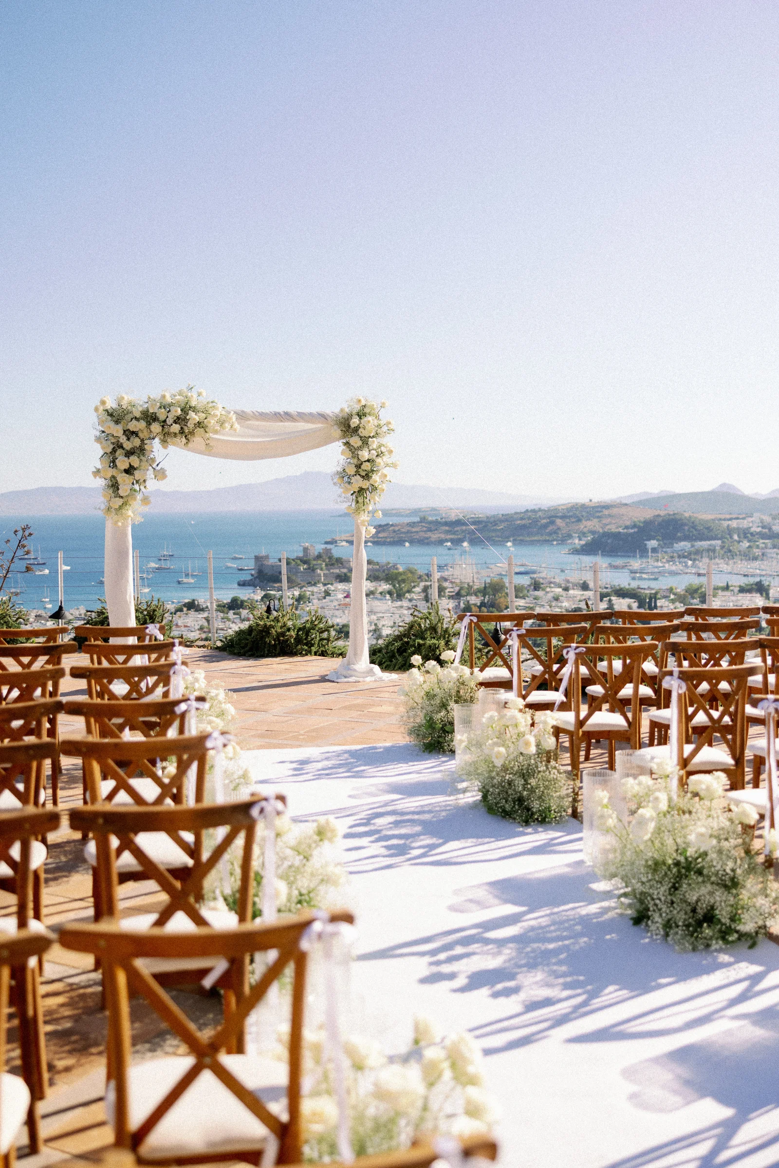 Ceremony aisle and floral arch facing the marina, The Marmara Bodrum