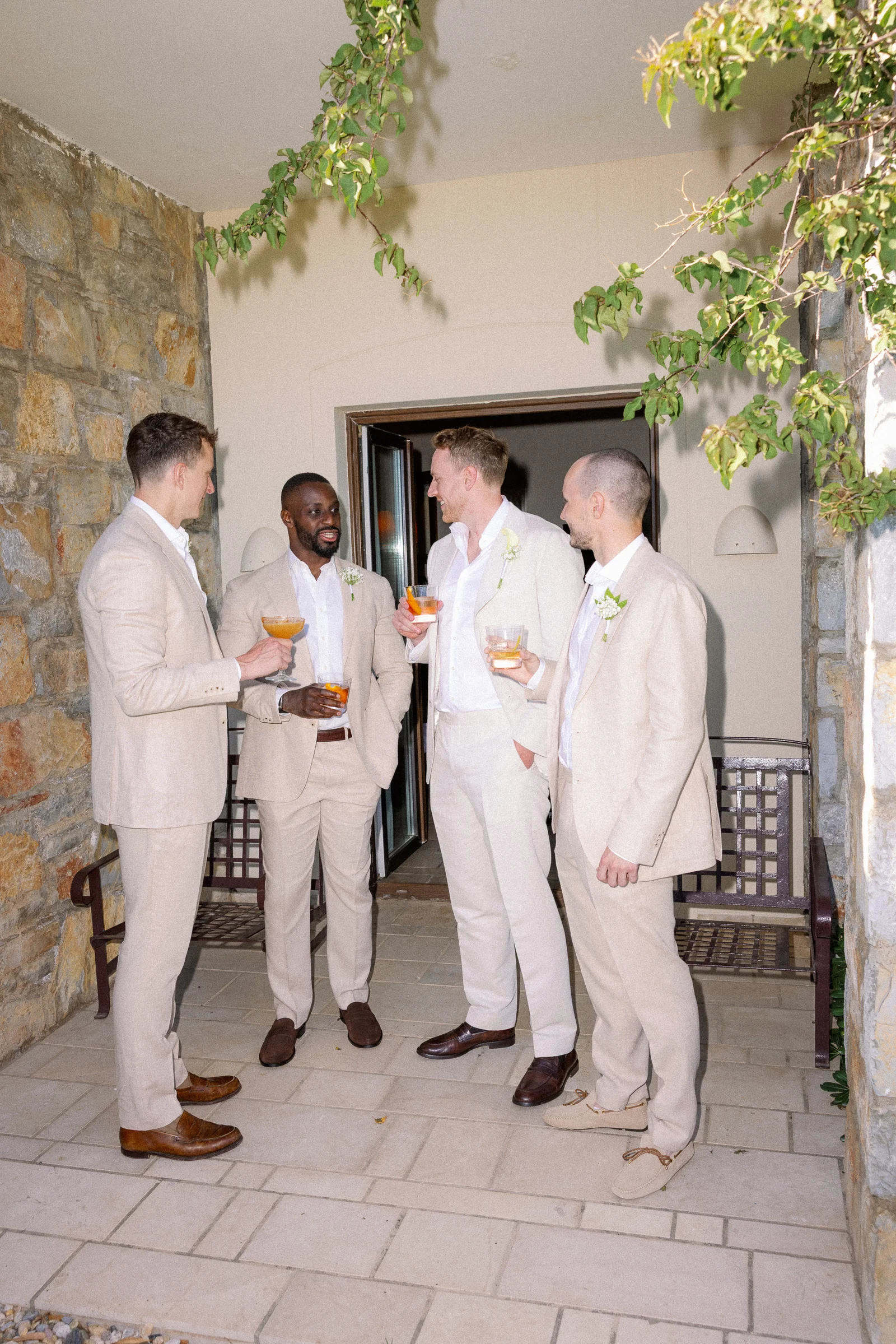 Groom and groomsmen by the stone wall, The Marmara Bodrum