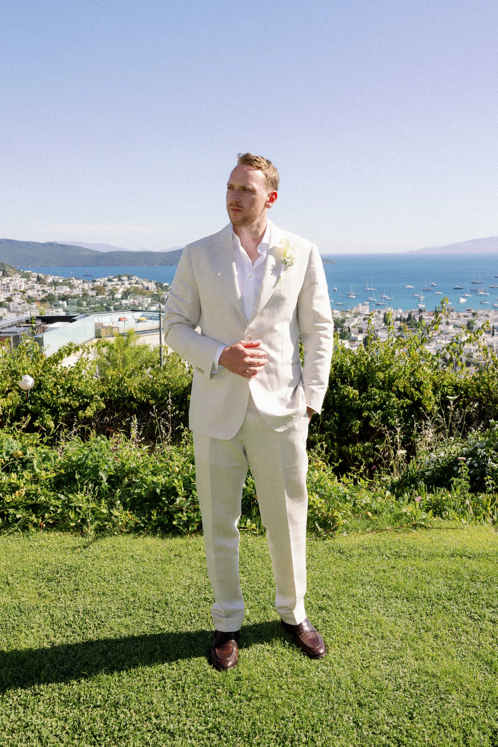Groom on the lawn above Bodrum bay, The Marmara Bodrum
