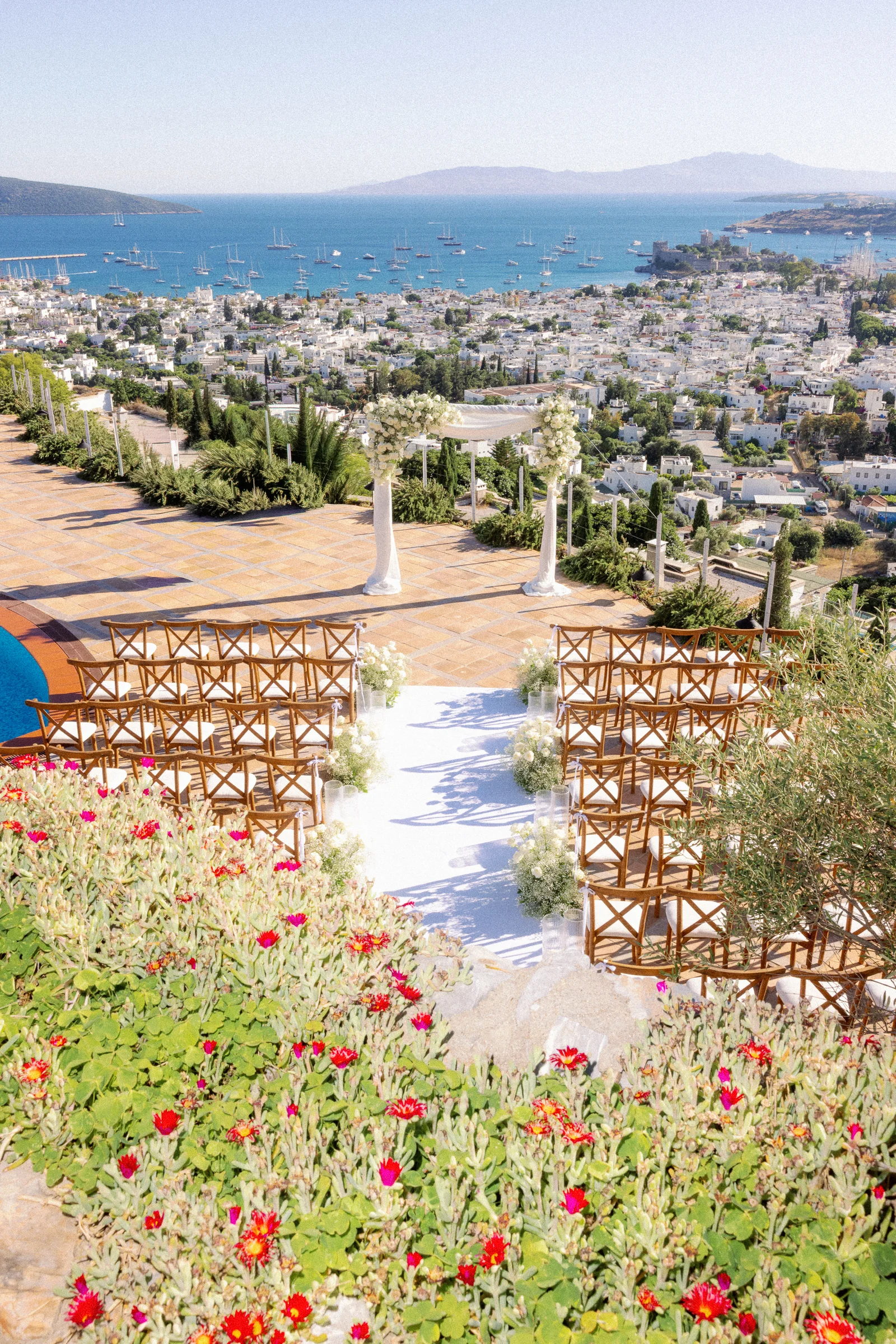 Ceremony set above the bay with poppies, The Marmara Bodrum