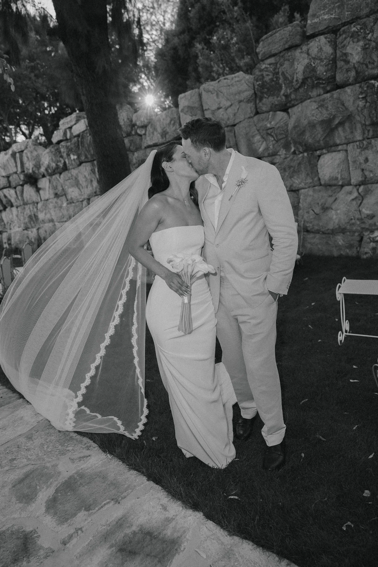 Kiss against the stone wall in black and white, The Marmara Bodrum