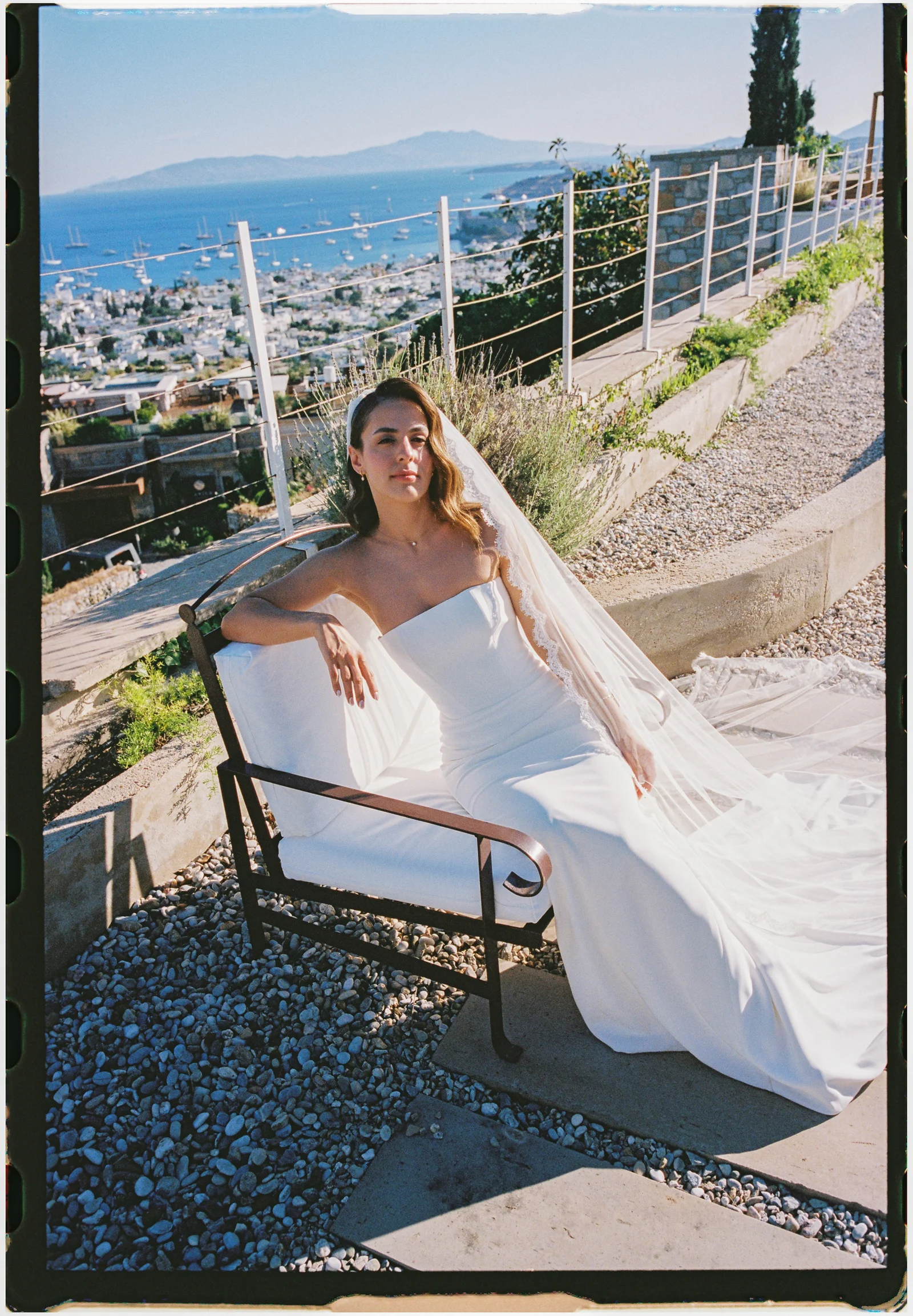 Bride and her veil on the bench on film, The Marmara Bodrum, Bodrum