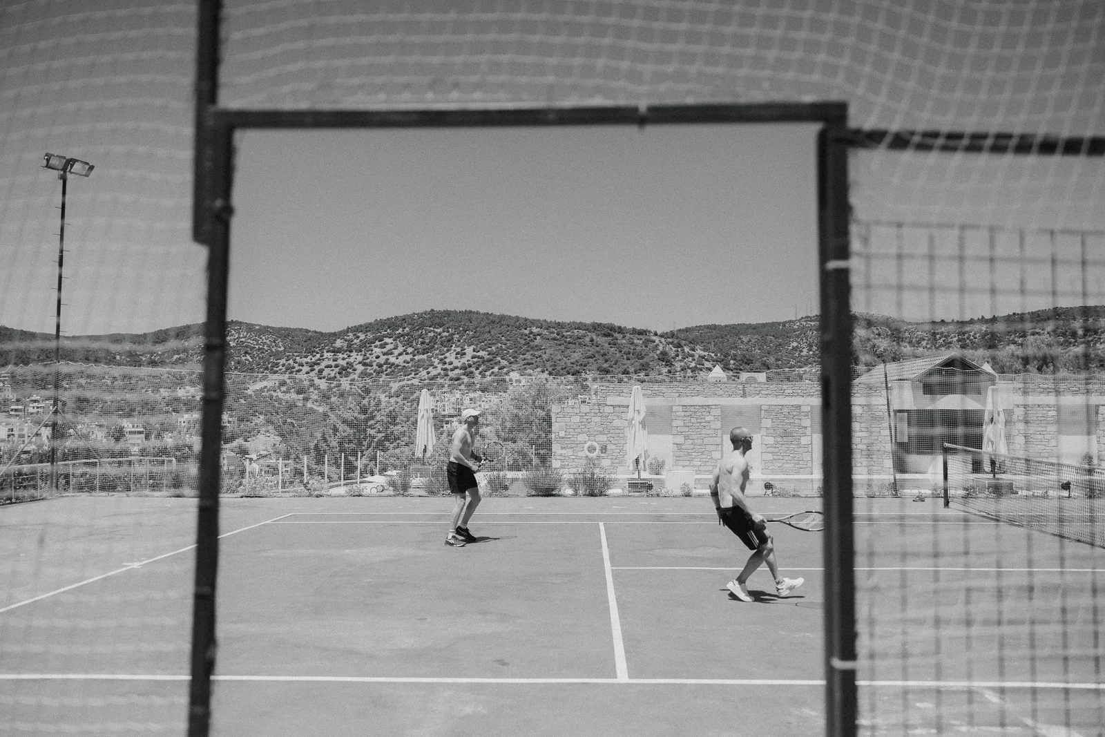 Tennis court seen through the fence at The Marmara Bodrum, Bodrum