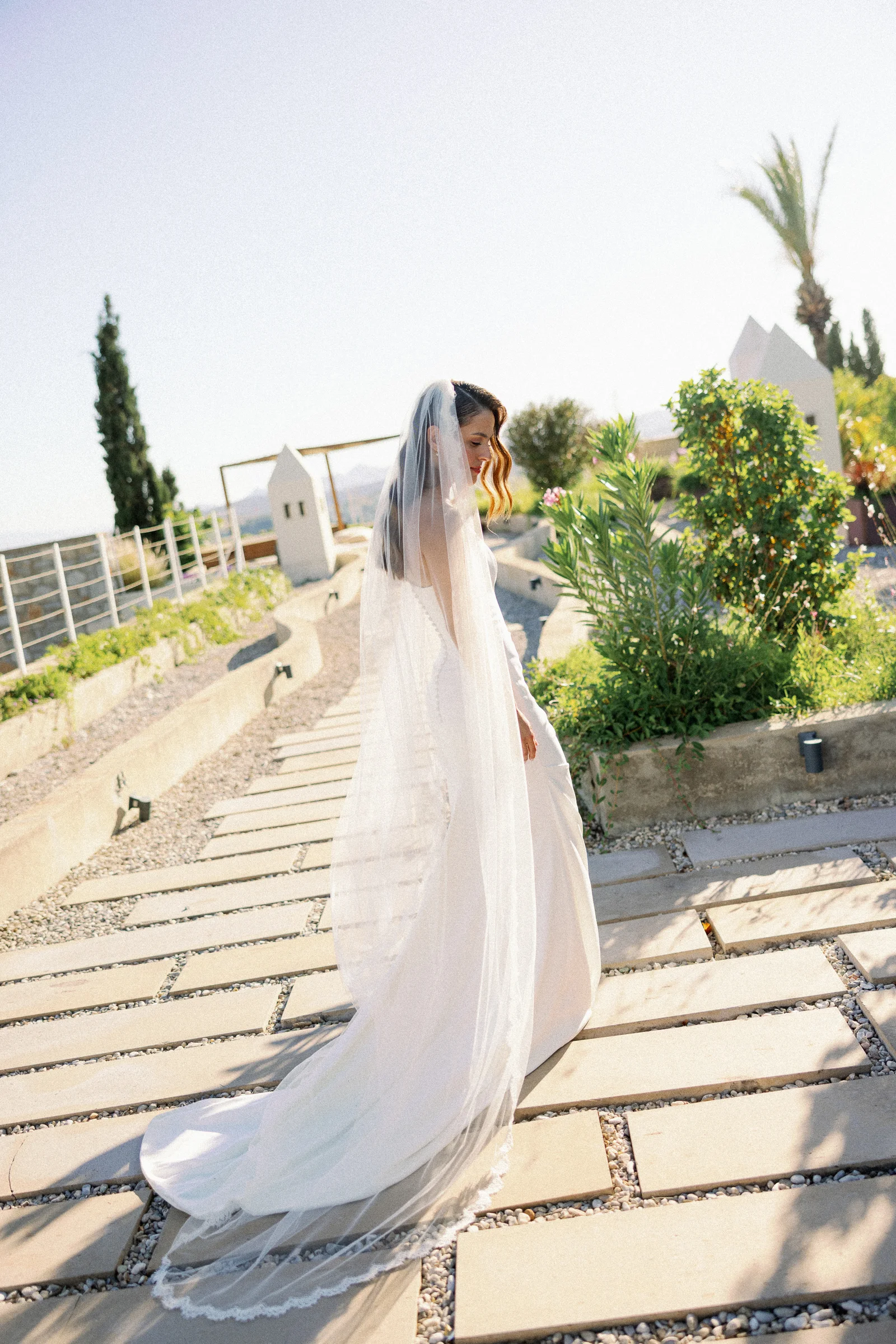 Bride on the stone path with a long veil, The Marmara Bodrum