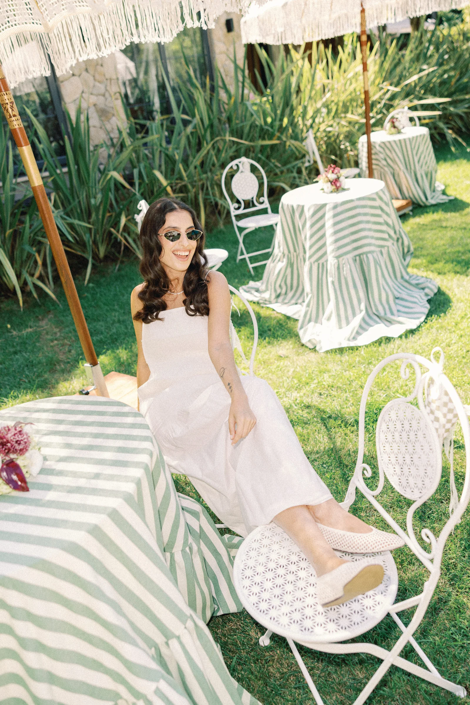 Bride at a green striped table, Kalea Place İstanbul garden wedding