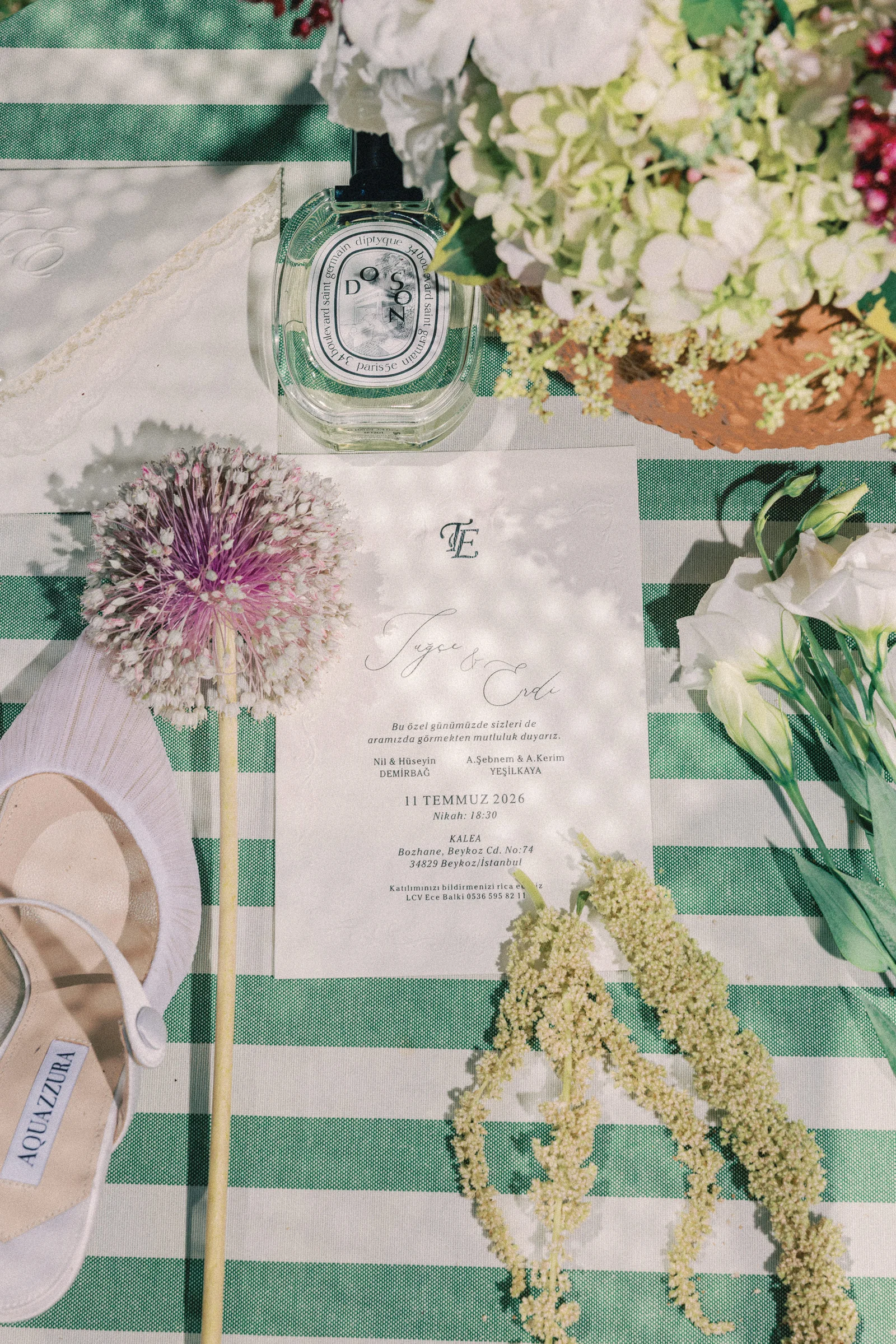 Wedding invitation and bridal shoes flat lay at Kalea Place İstanbul