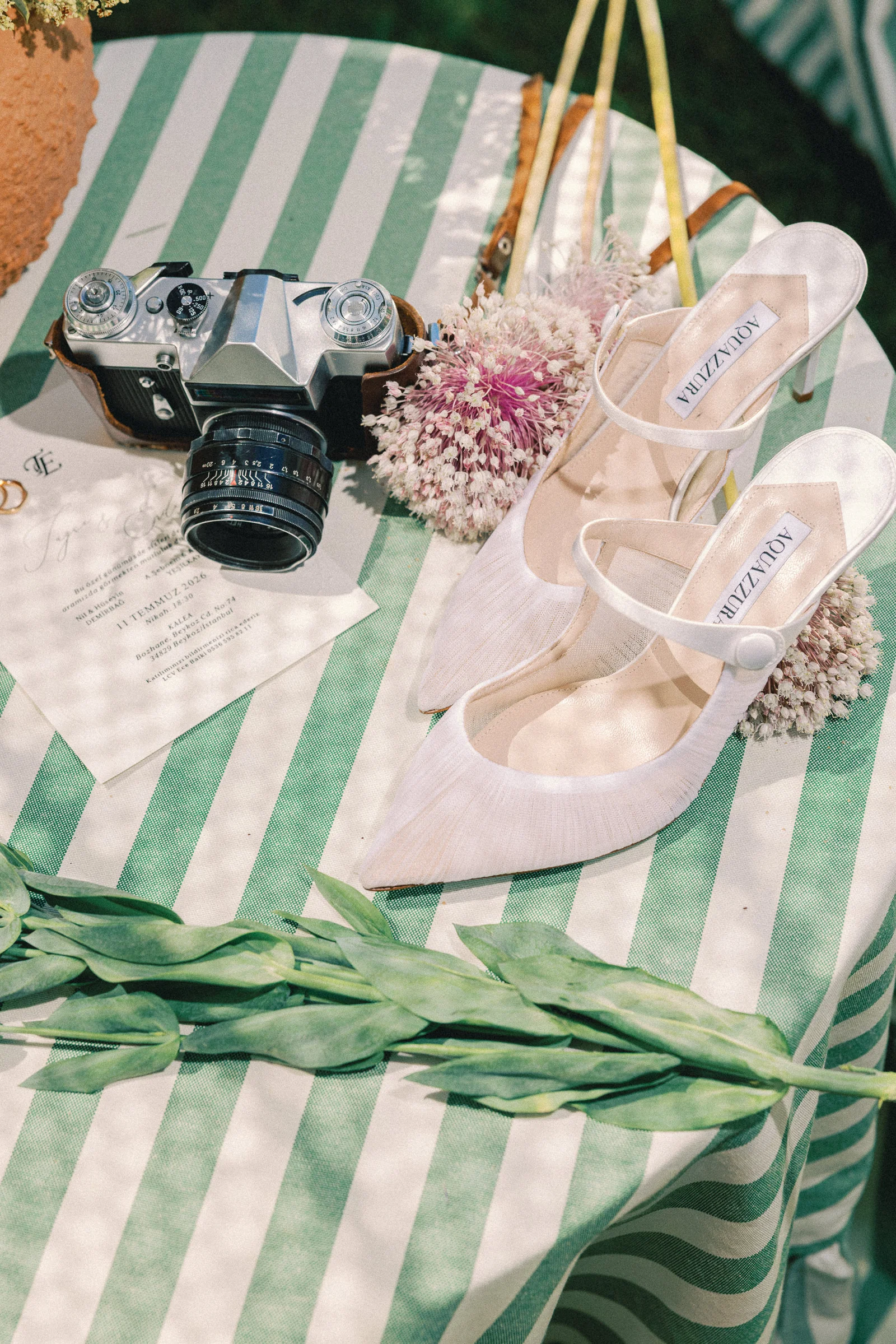 Film camera and bridal shoes detail at a Kalea Place İstanbul wedding